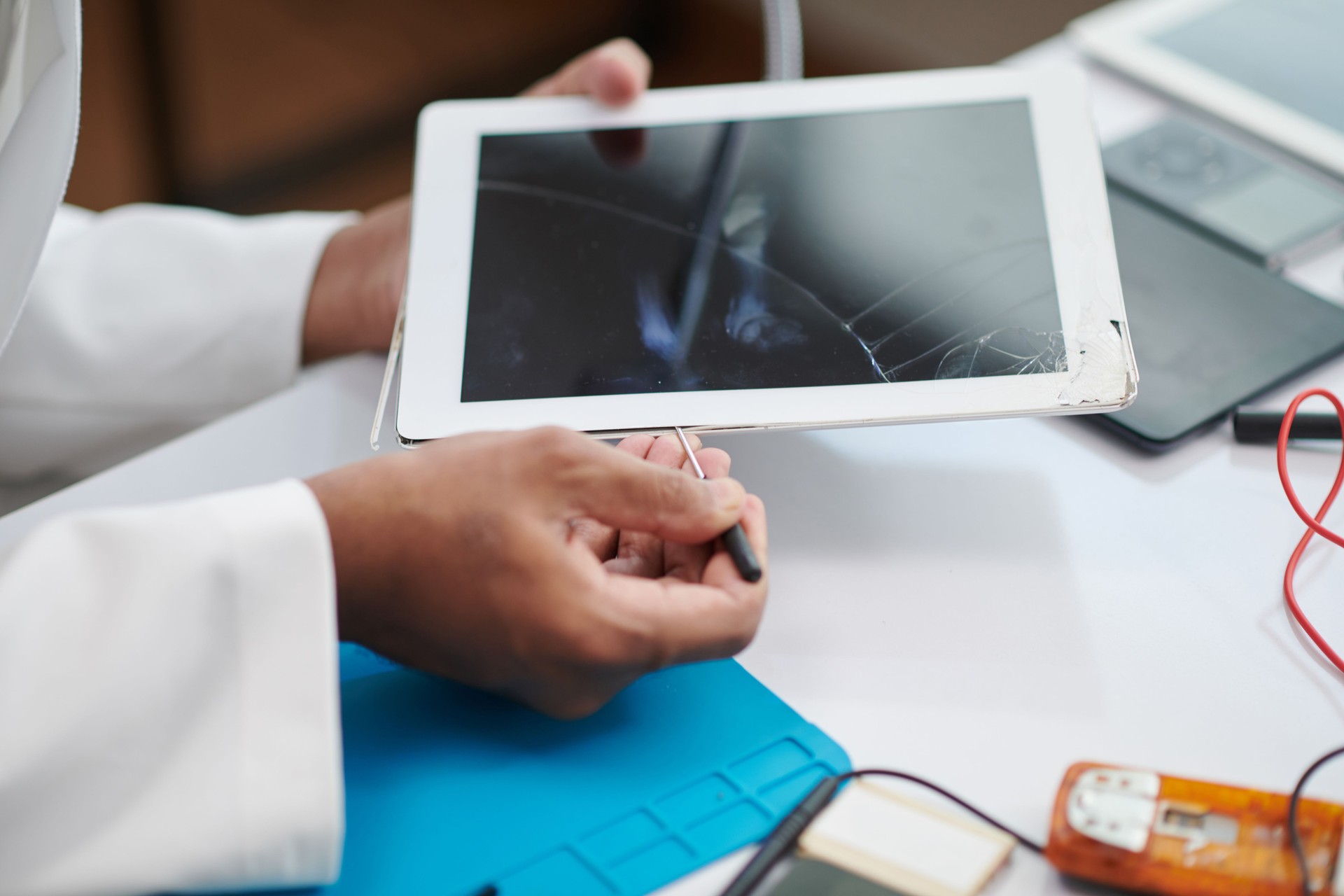 Technician Replacing Tablet Screen