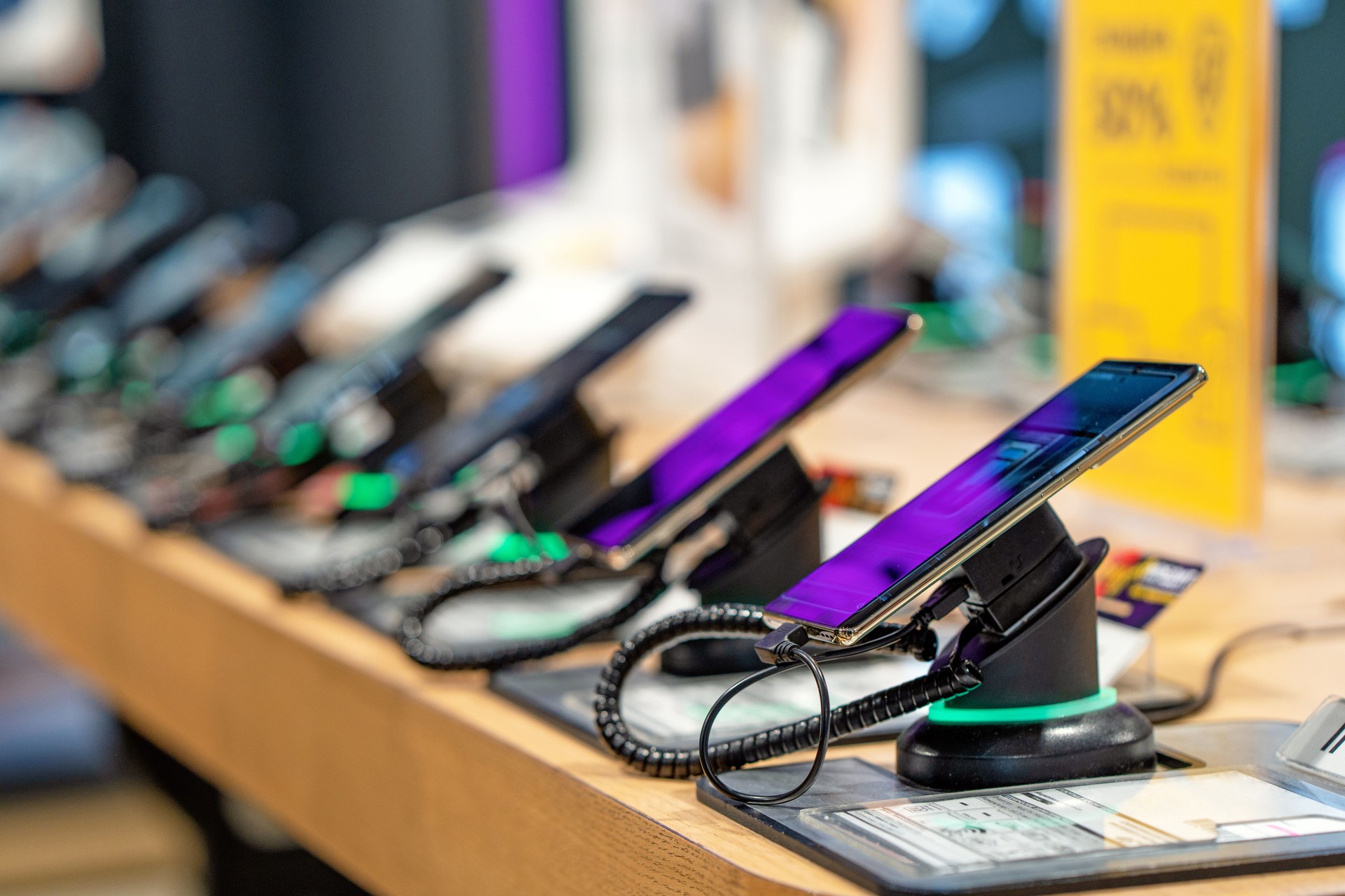 Showcase with smartphones in the modern electronics store.